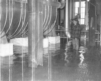 Download The great flood inundates the Distillery, cresting at 17 feet above the power plant, four feet above Warehouse H