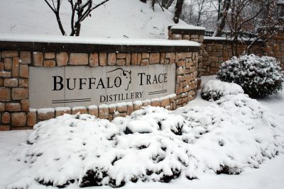 Download Stone wall snow-covered entrance to Buffalo Trace Distillery