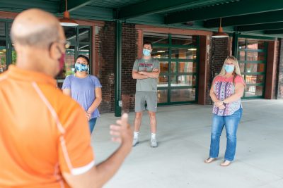 Download A picture of tour guide Freddie Johnson giving a Buffalo Trace Distillery tour in masks intended for media kit usage.