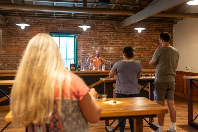 Download A picture of a Buffalo Trace Distillery tour group tasting bourbon with Freddie intended for media kit usage.