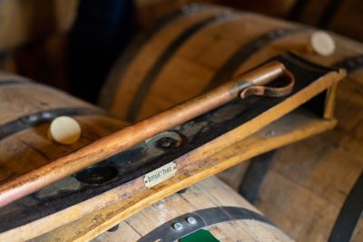Download An up close picture of a barrel tasting portion of a Buffalo Trace Distillery tour intended for media kit usage.