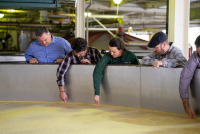 Download A picture of a Buffalo Trace Distillery tour group touching the mash in fermenters intended for media kit usage.