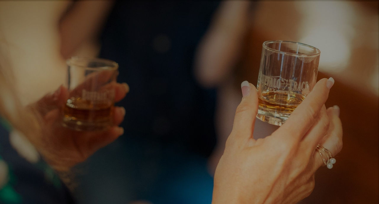 Woman holding glass of Buffalo Trace 